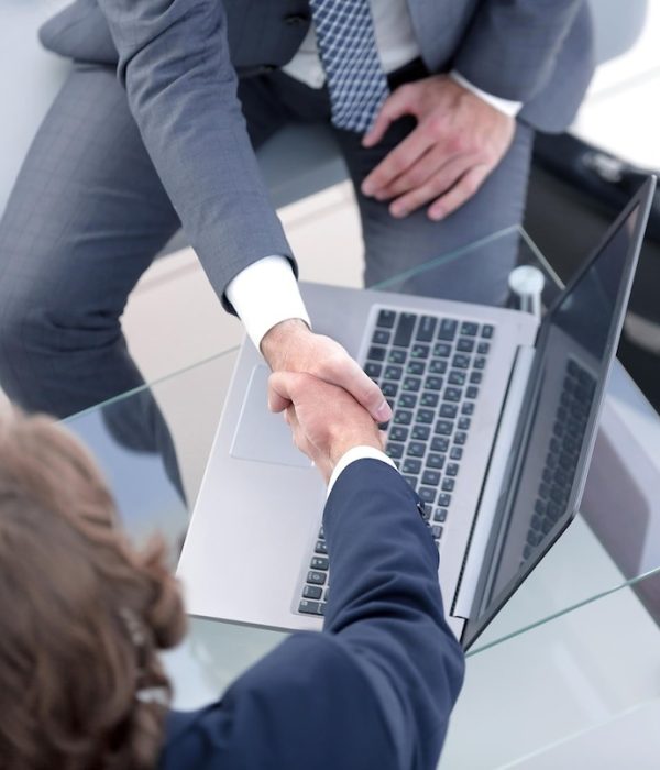 handshake-business-partners-desk